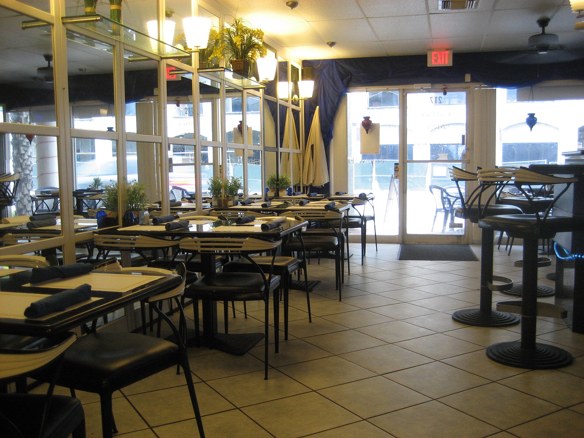 Warm restaurant interior with set tables and soft lighting