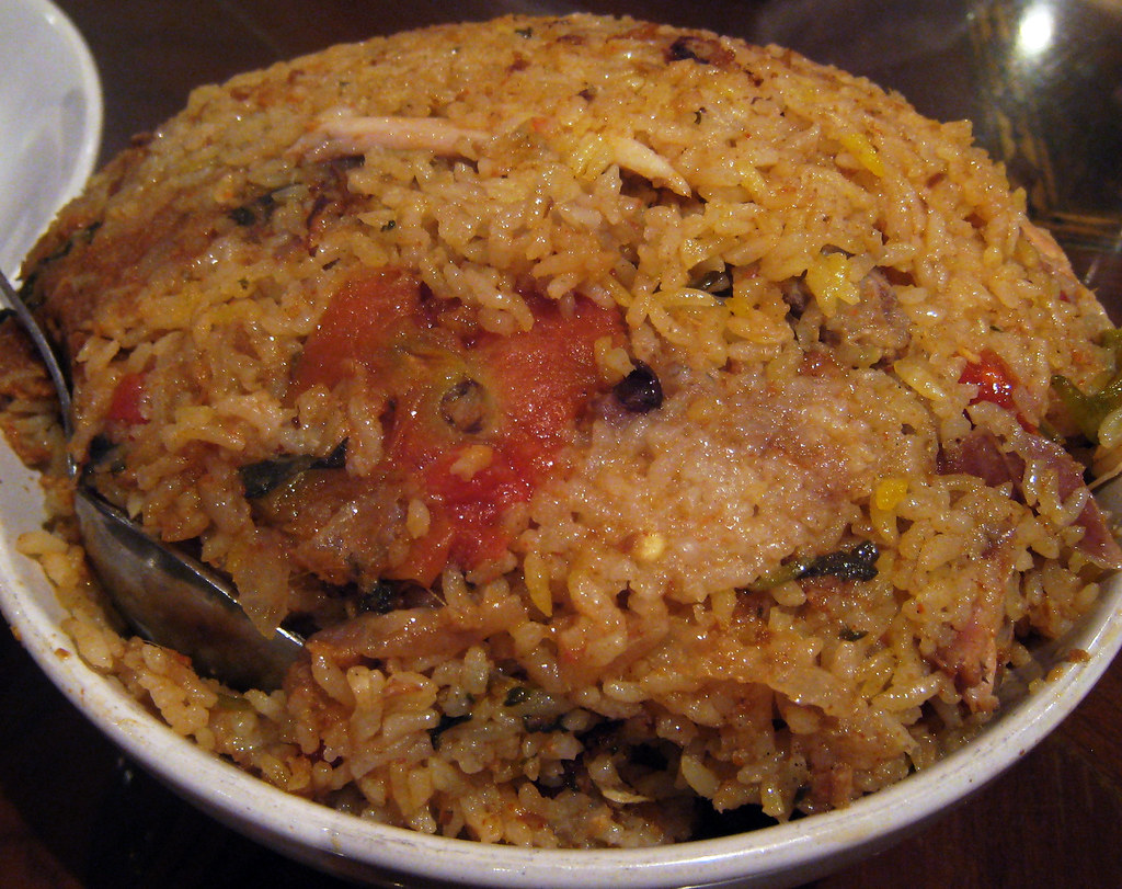Hyderabadi chicken biryani layered with saffron rice in a serving dish