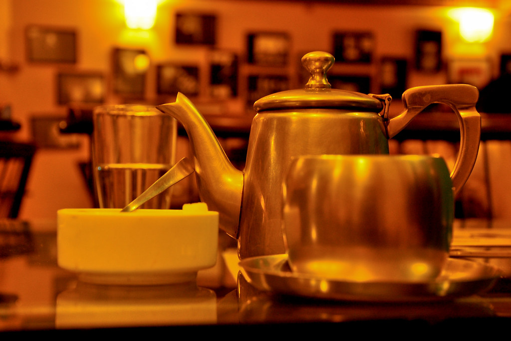Hot masala chai tea poured into a glass